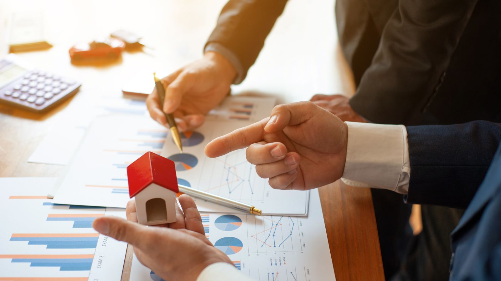 People discussing pros and cons of real estate investment - growthcentscom